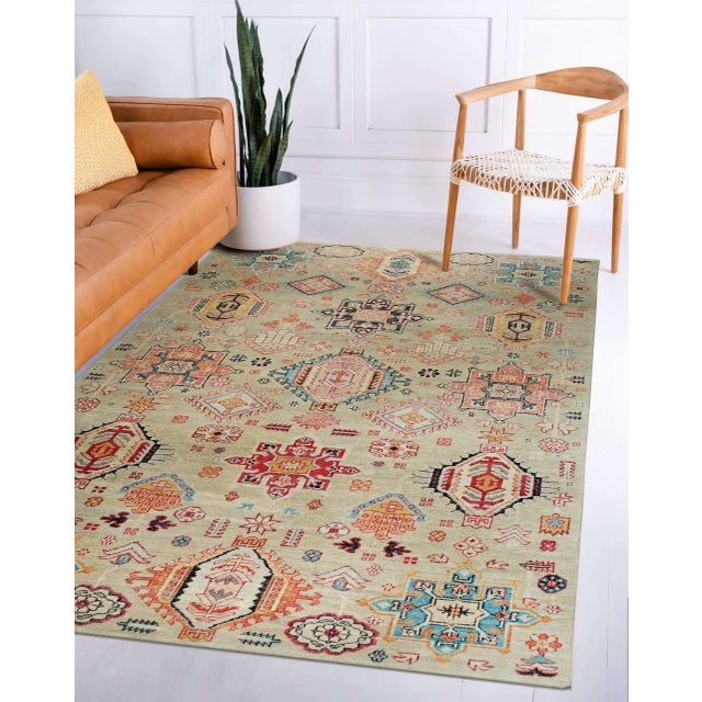 Lush Oriental Ivory Hand Knotted Wool Rug, Country of Origin: India. This exceptional piece is a contemporary...