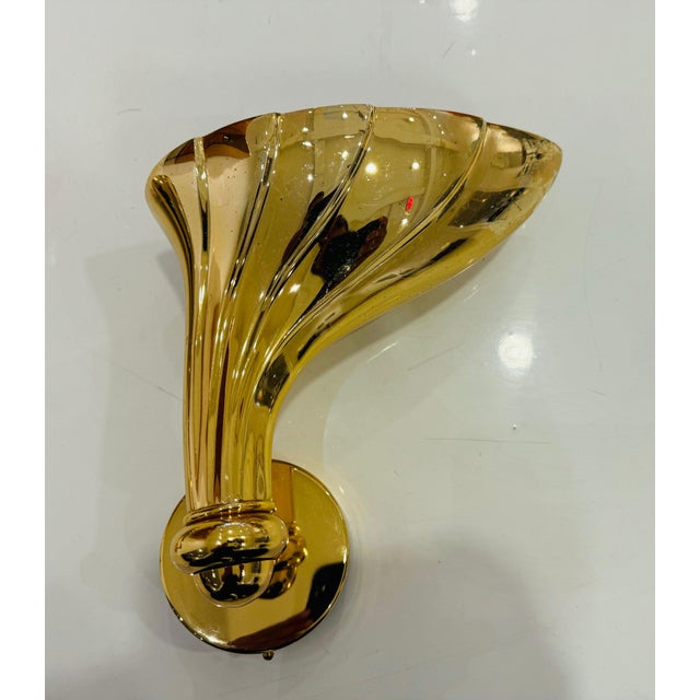 A pair of high quality heavy cast polished bronze floral wall lights by the Italian lighting maker, Fratelli Martini....