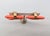 1950s goldtone two coral pink resin hoops one inside the other with smooth goldtone top butterfly clip back earrings....