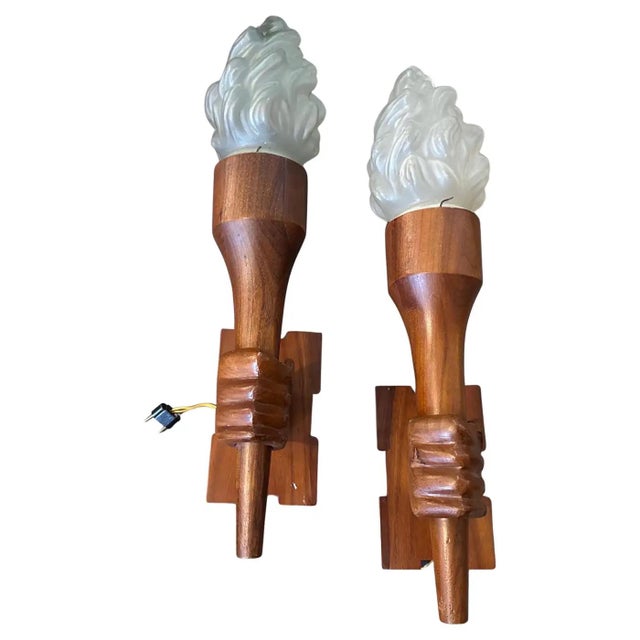 This set of two 1940s Italian Art Deco wall sconces is a beautiful and sculptural representation of the era's...