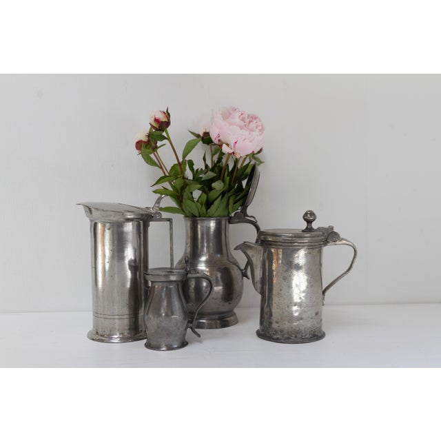 Antique English Pewter Tankards, 18th century. Set of 4. Highly decorative set of four English jugs or tankards with...