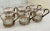A set of 6 glasses held by a metal framework with handle. The metal has a wonderful greek key framework. A compliment to...