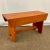 We have here a delightful handmade Americana Folk Art Pine Bench. It’s finished in a mellow orange with pin striping...