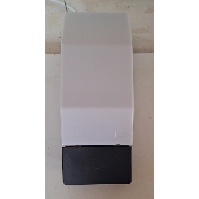 Vintage Wall Lamp with White Plastic Shade, 1990s, in Very Good conditions. Designed 1990 to 1999 This piece has an...