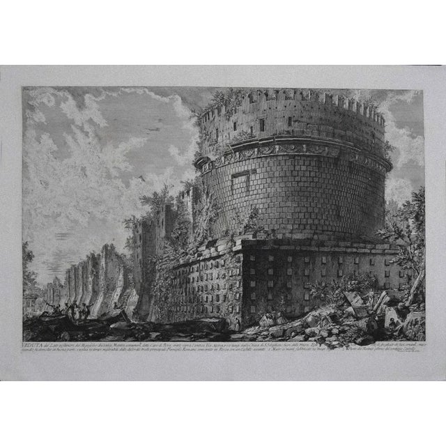 View of Mausoleo of Cecilia Metella is an original etching realized by the italian artist Giovanni Battista Piranesi in...