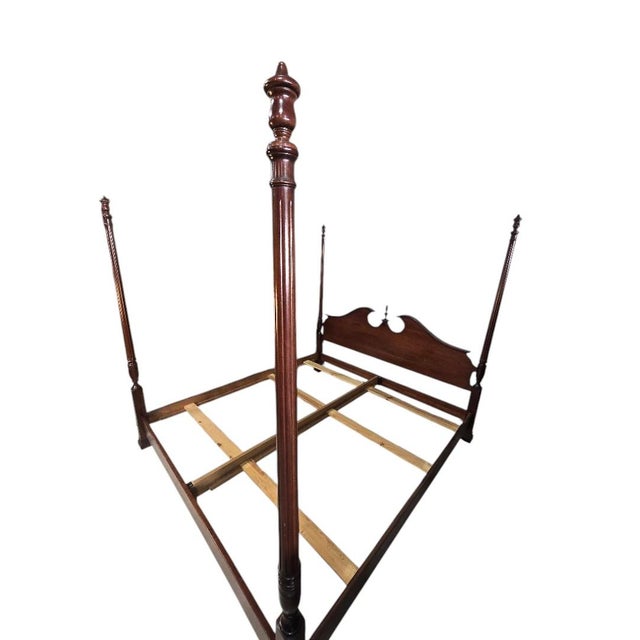 A classic Chippendale-style king four poster bed showcasing elegant proportions and timeless craftsmanship. The gracefully...