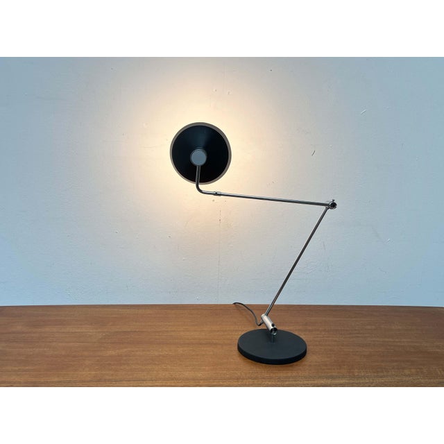 Minimalist table lamp by the Swiss manufacturer Baltensweiler, designed by Rosemarie and Rico Baltensweiler in the 1950s....