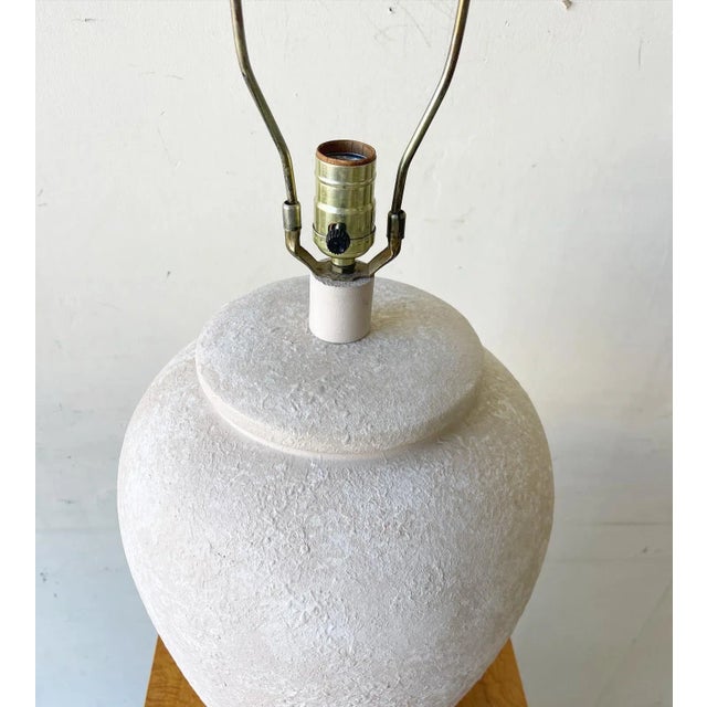 Exceptional vintage postmodern ceramic table lamp. Features a textured almond finish. 3 way lighting