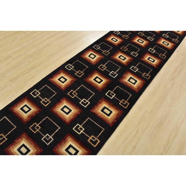 A contemporary Gabbeh runner hand-knotted with fine wool on a cotton foundation. This rug features an all-over pattern of...