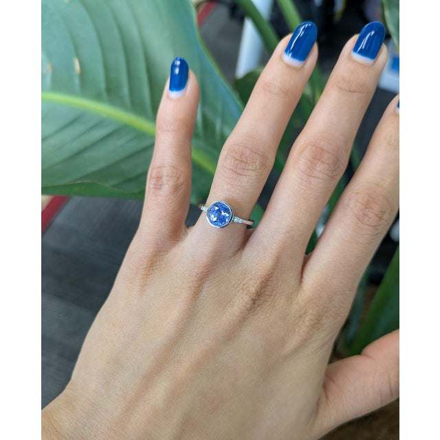 Elegant and captivating, this ring features a 1.9 ct round tanzanite with a rich violet-blue glow. Set in solid 14K gold,...