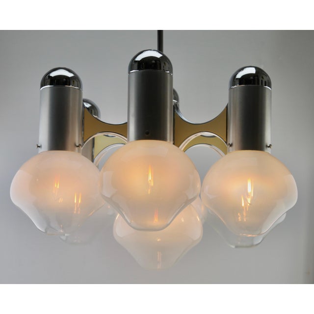 Six-arm chrome and opaline glass chandelier, 1960s mid-century modern chandelier made in the 1960s. It has six chrome...