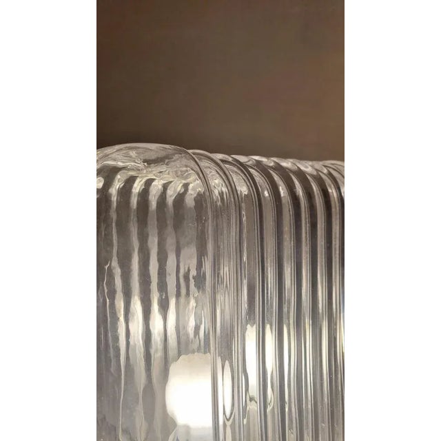 Table lamp mod. Lari designed by Angelo Mangiarotti and produced by Artemide in the 70s, first production. Glass lampshade...