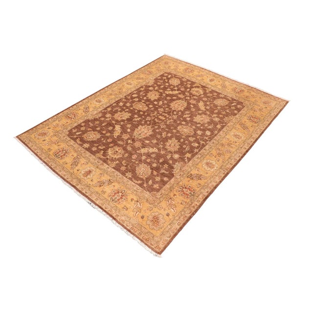 "Enhance the ambiance of your home with this magnificent Persian-influenced Turkish hand-knotted rug made by skilled...