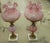 A pair of Mid Century vintage Fenton "Gone With the Wind" lamps in pink custard satin glass with a cabbage rose / poppy...