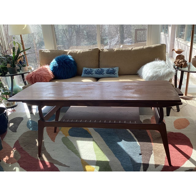 This stunning and unique vintage midcentury modern coffee table transforms into a dining table. It is perfect for small...
