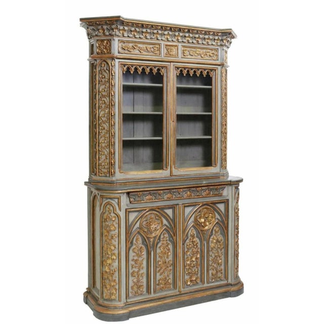 A rare and magnificent 19th century Gothic Revival hand carved painted parcel gilt bibliothèque (today use as a bookcase -...