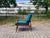 This Wilhelm Knoll Antimott easy chair features its original petrol-blue upholstery, innerspring seating, and an oiled...
