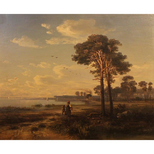 This original 19th-century oil painting presents a wide and atmospheric Romantic landscape with figures, a tranquil lake,...