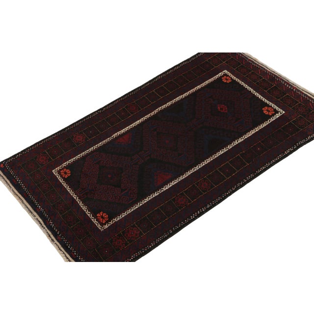 Hand knotted in wool, this 3x6 Baluch runner rug represents a new line of tribal carpets in the Modern Classics Collection...