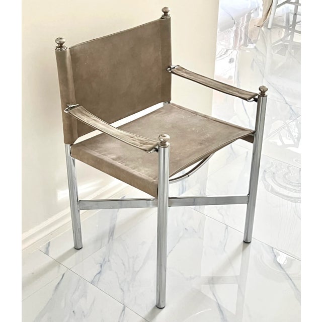 A vintage campaign-style director’s arm chair, dating to the late 20th century, executed in suede leather with chrome...