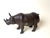 This striking handcrafted bronze rhinoceros sculpture captures the strength, dignity, and timeless presence of one of...