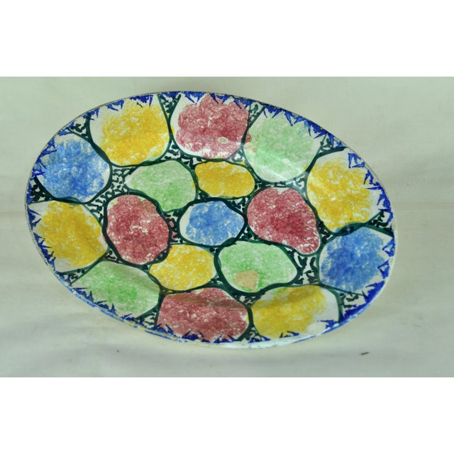 It has some bursts without affecting the piece due to the passage of time and use. to see photos