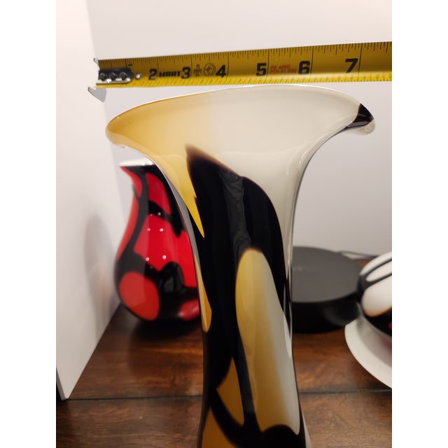 This is a spectacular, visually arresting trio of vintage 1970s Italian art glass vases. This hand-blown set features a...