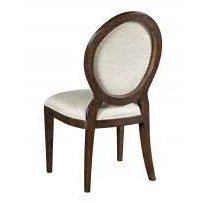 A lovely chair with an oval shaped upholstered back over an upholstered seat elevated by squared tapering legs.