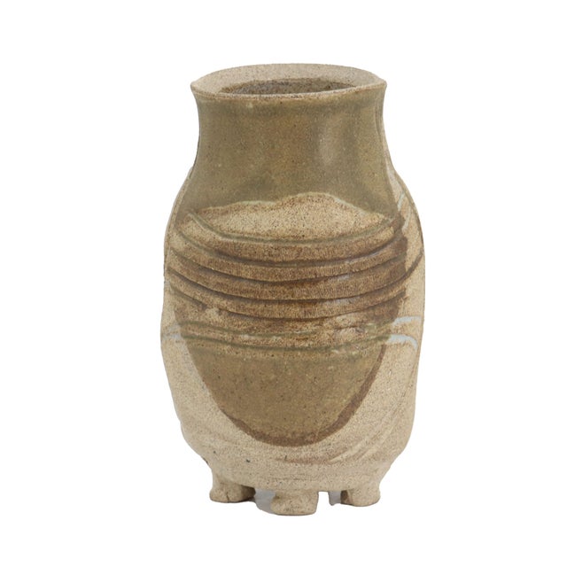 A sculptural studio pottery vessel by American ceramic artist Charles Counts, signed and dated 1988. Raised on four...