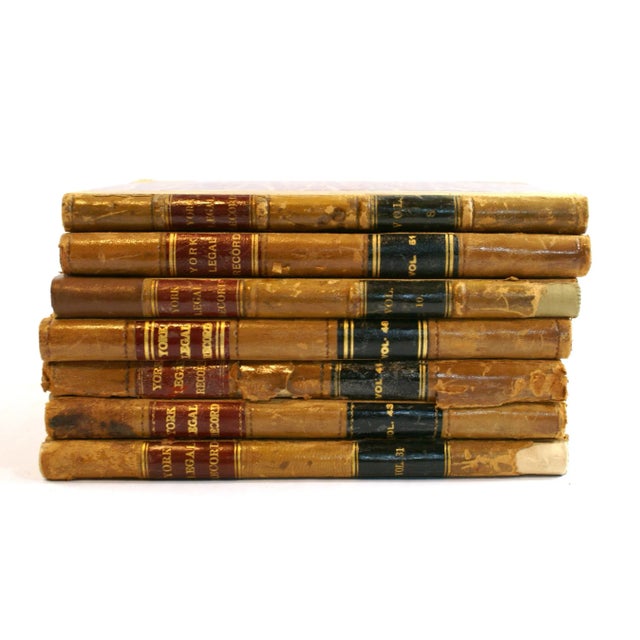 A lovely, old set of 7 antique leather books with decorative book paper and leather covers. The books are from part of a...