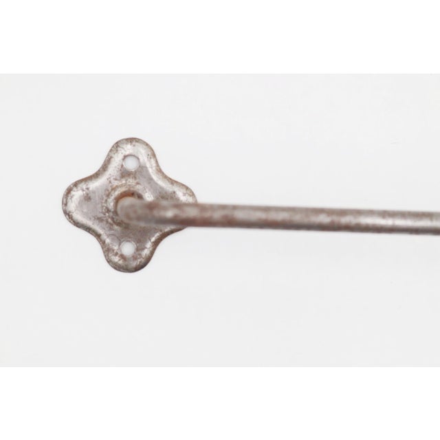 Vintage surface mount steel towel rack with a nickel finish and clover shaped backplates. The original mounting screws are...