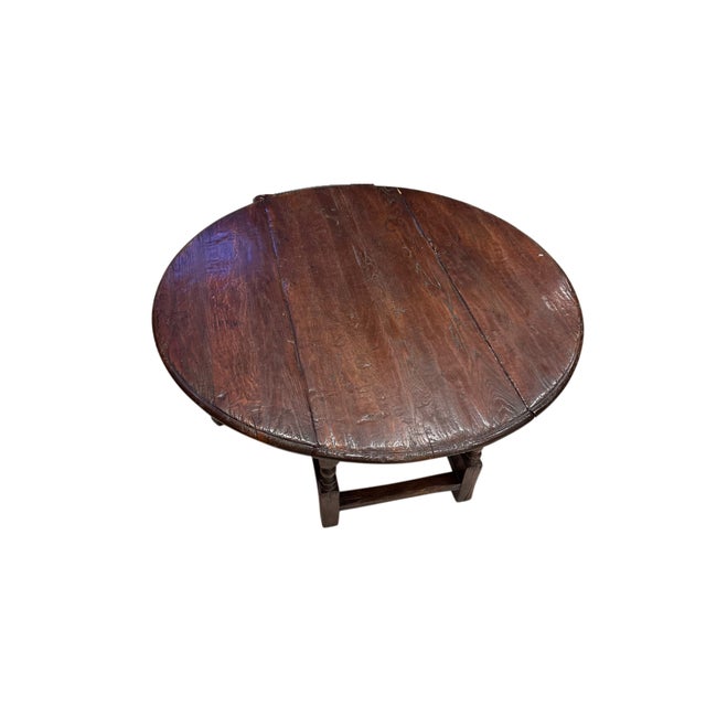 Crafted from solid English oak, this antique drop-leaf coffee table showcases the timeless beauty of traditional English...