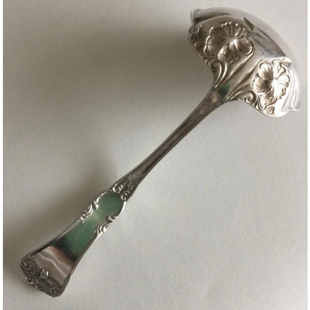 This piece looks like it is from the early 1900s to me. It's a silverplate ladle in an elegant, traditional pattern with...