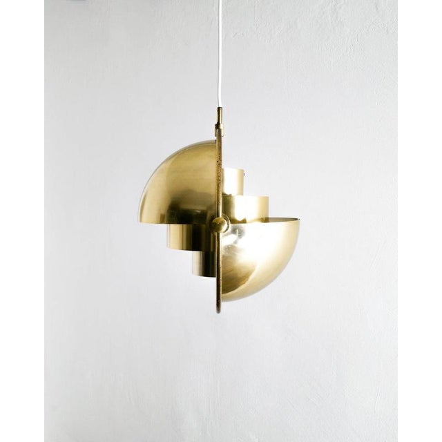 Rare, early and original danish mid century "multi lite" adjustable ceiling lamp pendant in beautifully patinated brass...