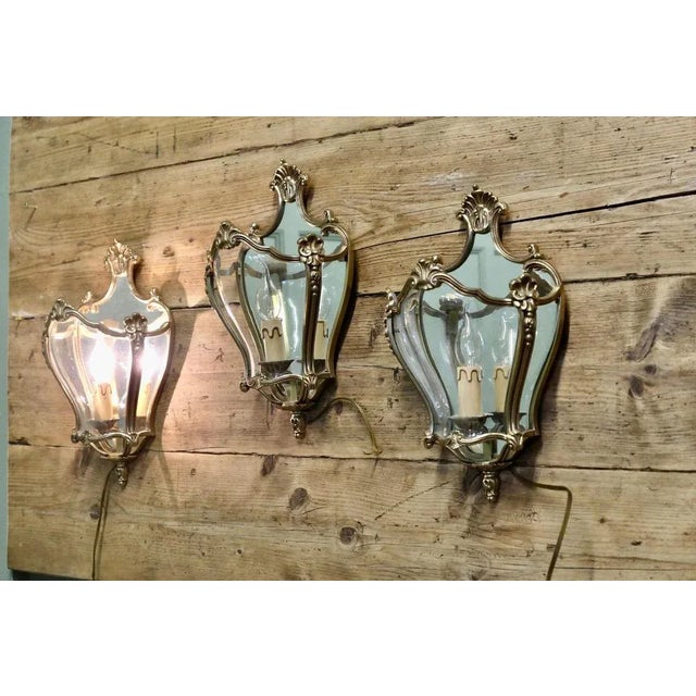 Set of 3 Louis XV Maison Arlus Style French Wall Lights These beautiful and rare lamps are made in brass and have mirrored...