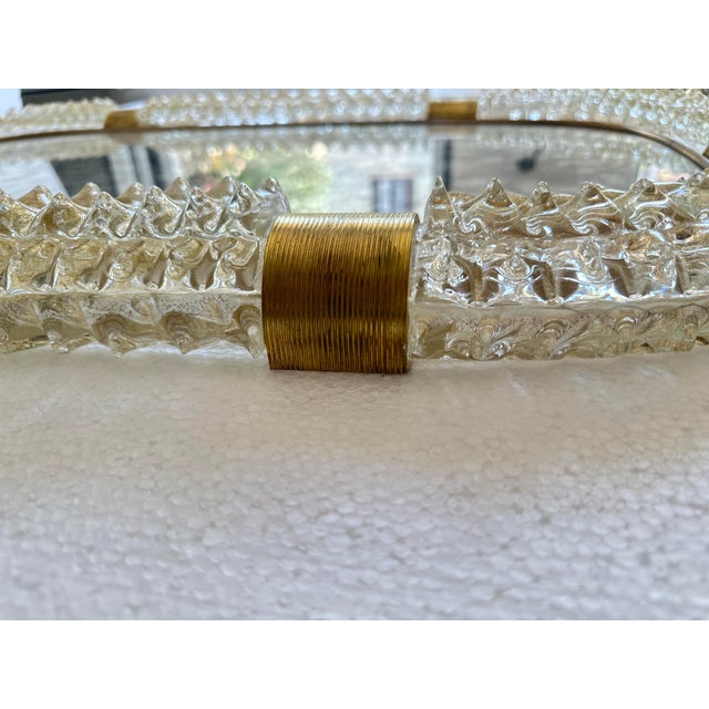 Luxury and scenographic "Rostrato" gold Murano Glass Wall Mirror . Impressive wall mirror in brass elements with...