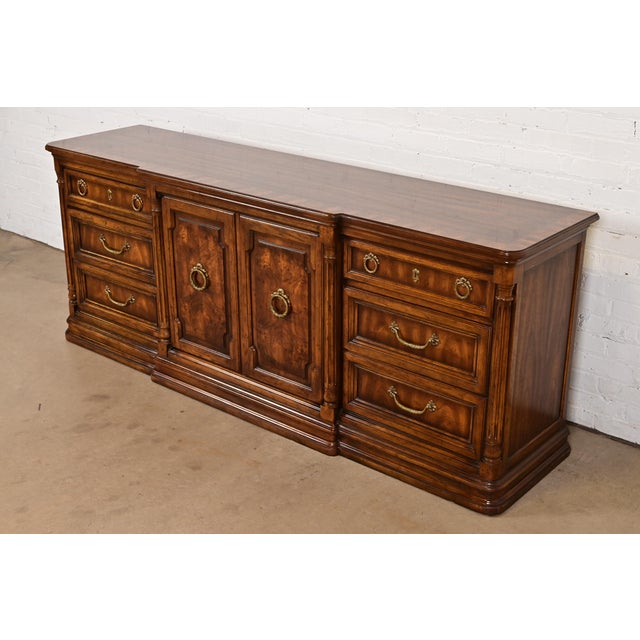 A gorgeous French Regency Louis XVI style long dresser or credenza By Drexel Heritage USA, Circa 1970s Carved burled...