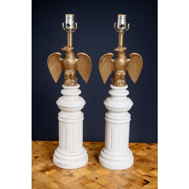 This striking mid-century table lamp features a classic Federalist design highlighted by a sculptural gilded eagle perched...