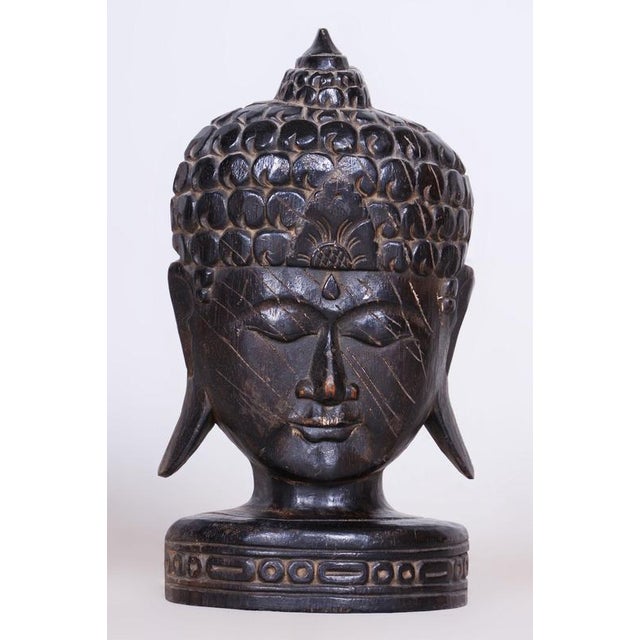 This impressive sculpture of Buddha's head dates back to the beginning of the 20th century and is an example of...