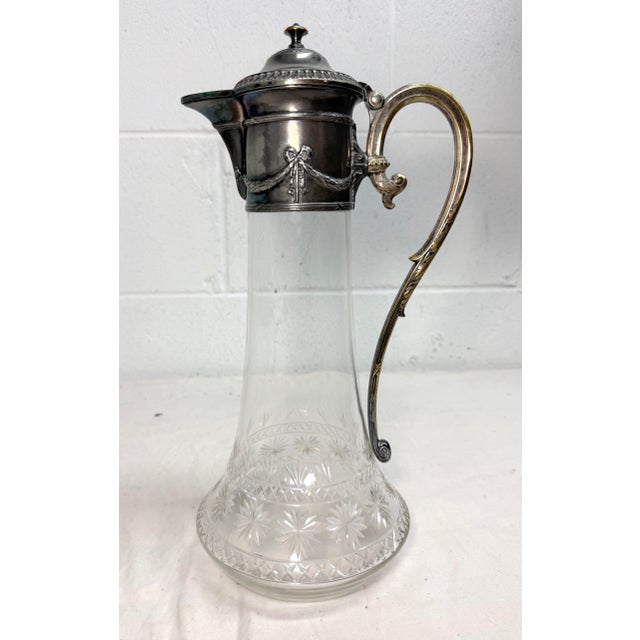 Crafted in the late 19th century Victorian era, this ornate silverplate WMF Jugendstil decanter exudes an air of elegance...
