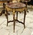 An exquisite French Louis XV style accent table showcasing a beautifully crafted marquetry top, elegant cabriole legs, and...