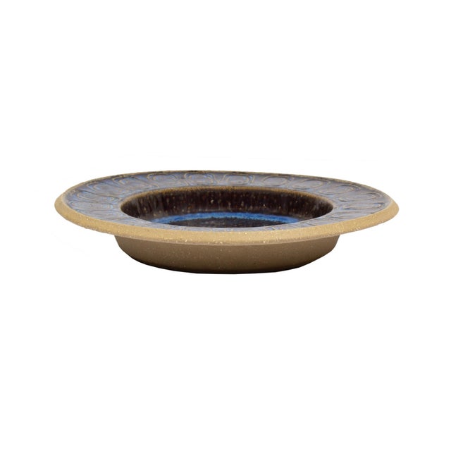 A Danish mid-century stoneware dish designed by German ceramicist Maria Philippi (1927-2004) and produced by Søholm. The...