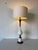 Elegant 1960’s Italian mid-century modern table lamp featuring a sculptural hourglass silhouette combining warm walnut...