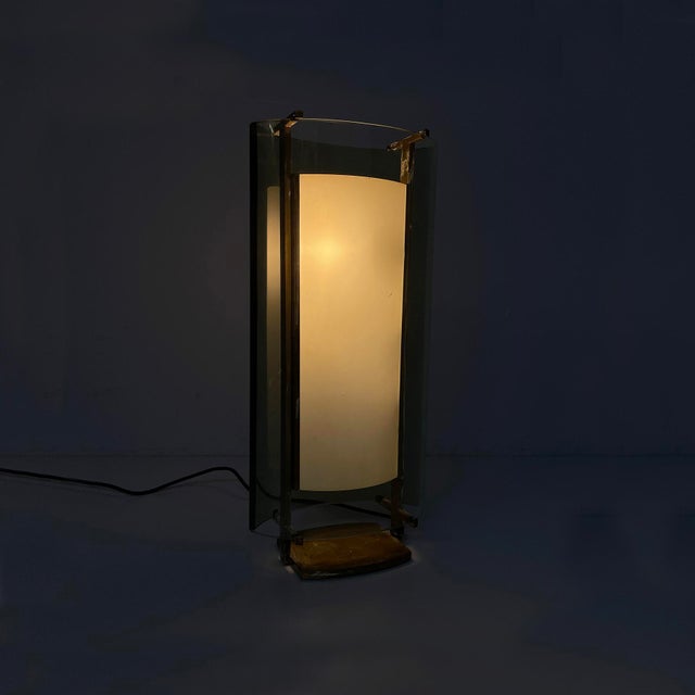 Italian mid-century modern table lamp by Max Ingrand for Fontana Arte, 1960s Table lamp with a brass structure. It...