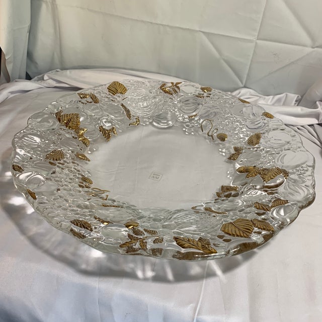 The item shown is a vintage embossed crystal platter made by IVV featuring a relief motif of pumpkins and detailed gold-...