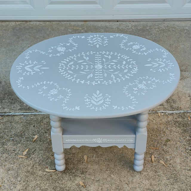 This is a cute oval coffee table or side table made of solid oak, with an oval top, carved spool or bobbin style legs, and...