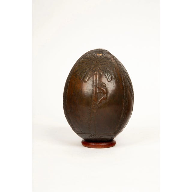 This rare mid-19th-century French Colonial carved coconut bugbear flask is a remarkable artifact that highlights the...