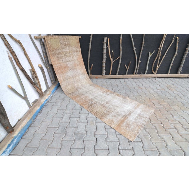 This spectacular Turkish runner rug was handmade in Anatolian lands in the mid 20th century. This Vintage Oushak runner...