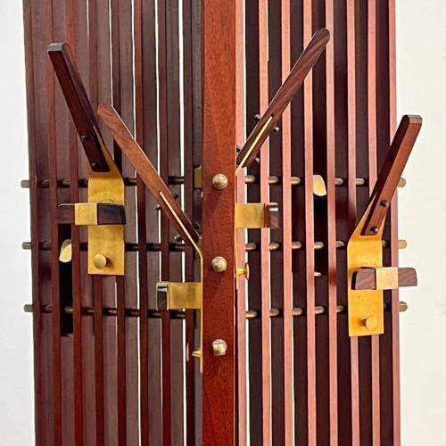 An elegant and sculptural mid-century swivel coat rack, produced by the renowned La Permanente Mobili Cantù cooperative in...