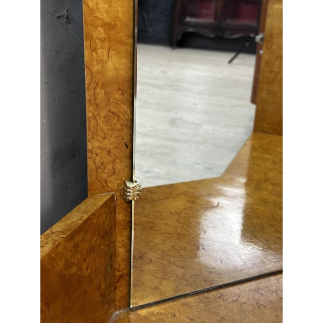 An elegant corner dressing table dating from the 1950s, crafted from speckled maple veneer. Its particularly decorative...